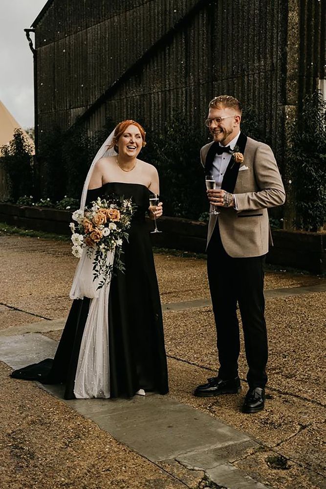 Black alternative wedding dress idea with white veil