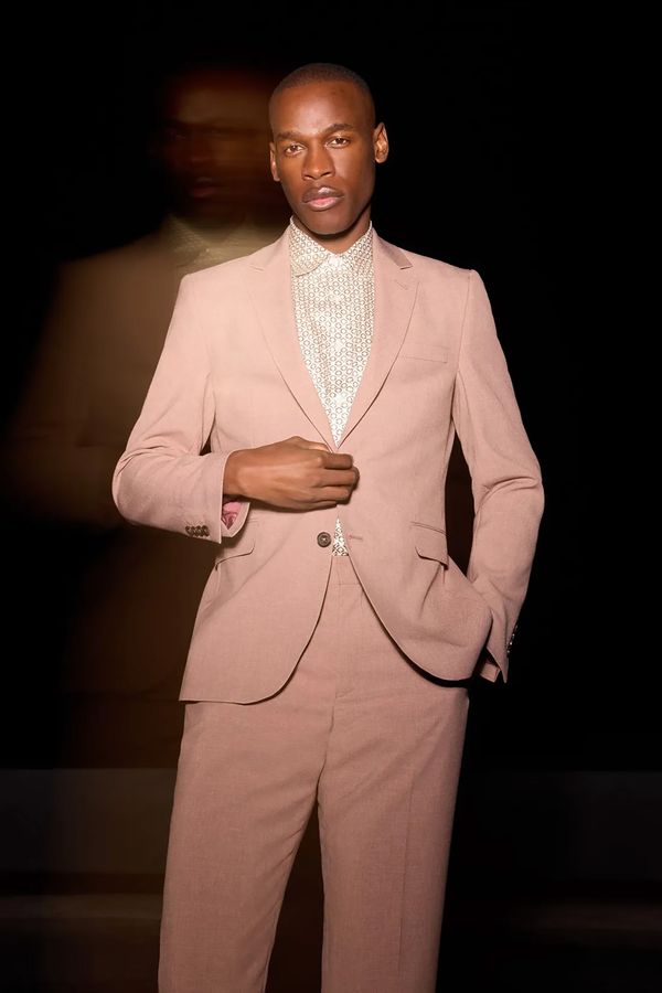 Dusty rose pink alternative wedding suit for the groom from Burton