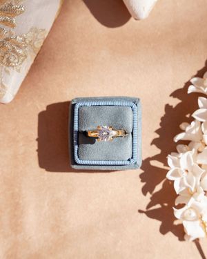 Round brilliant diamond engagement ring in blue velvet ring box