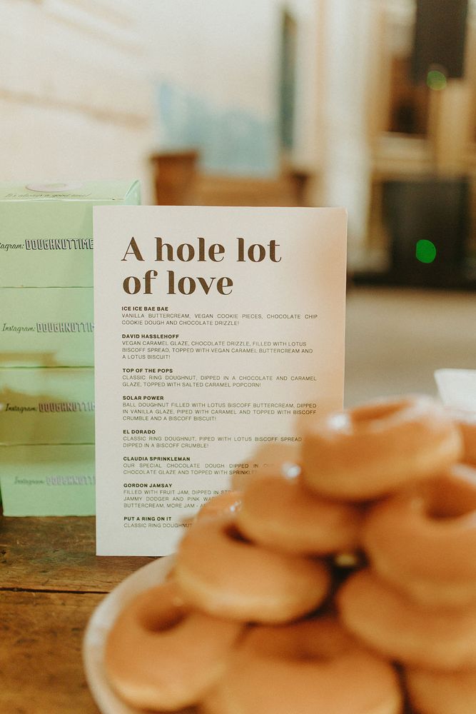 Plates of doughnuts for wedding favours with plenty of different flavours 