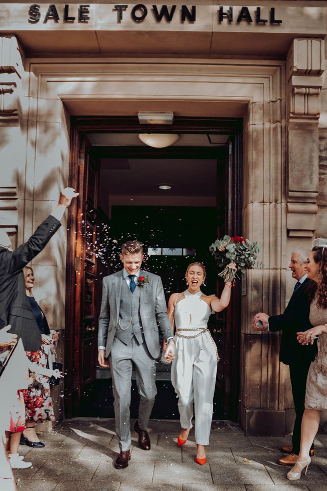City Chambers Edinburgh wedding with bride in a trouser and jacket suit with finger tip veil 