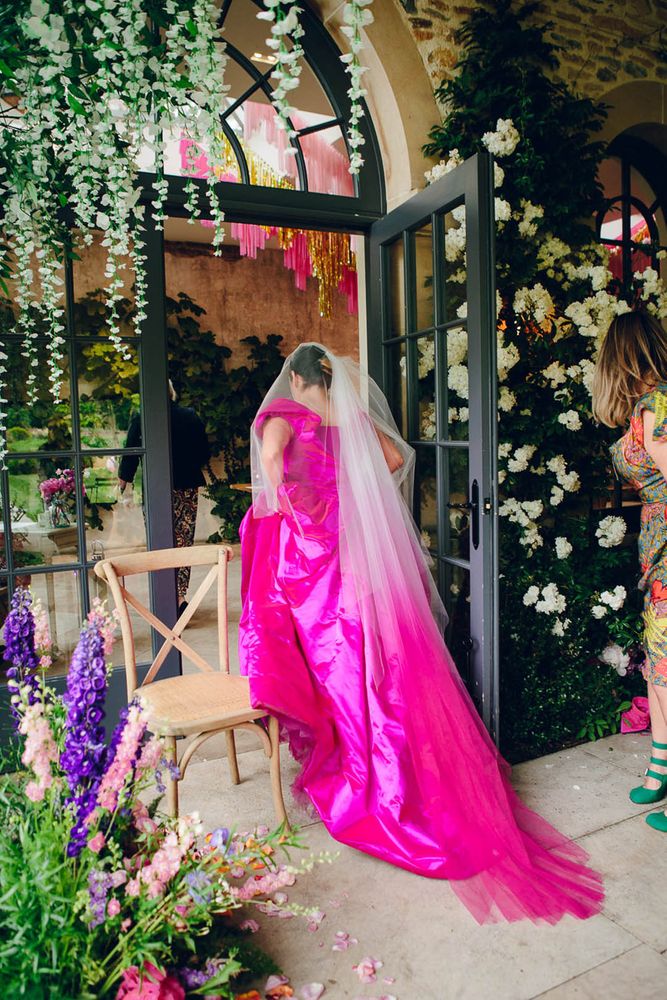 Bride wears bright pink Vivienne Westwood Princess wedding dress 