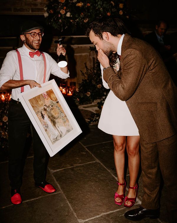 a live wedding illustrator produces a painting wedding keepsake