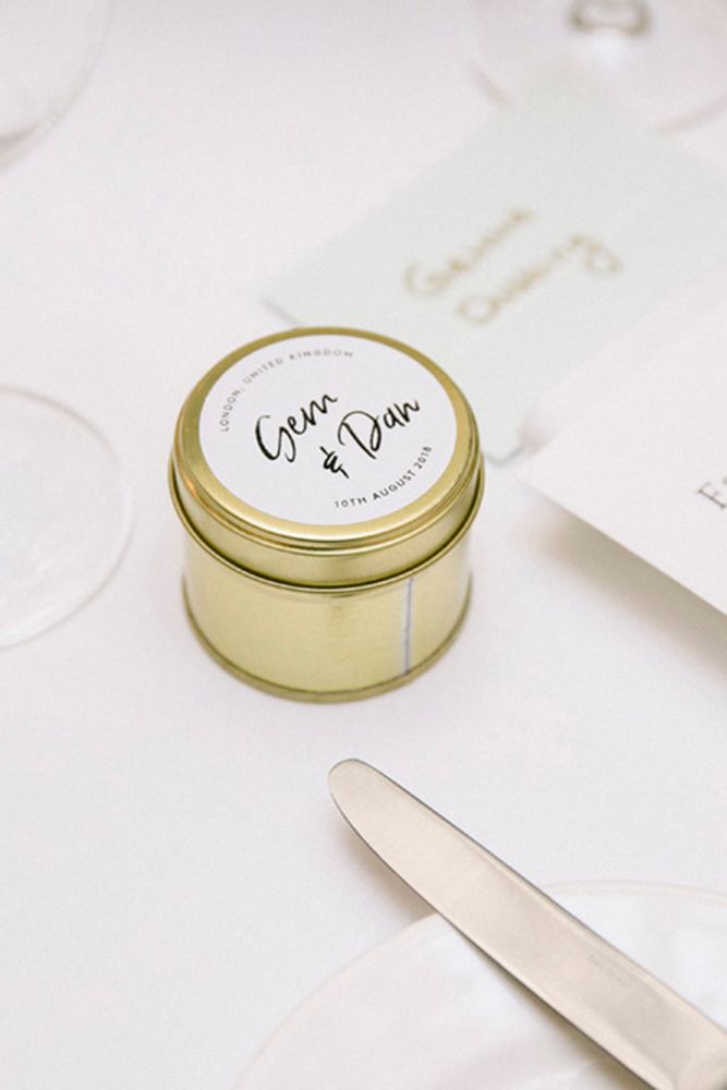 Small gold tea light with personalised label for wedding favours 